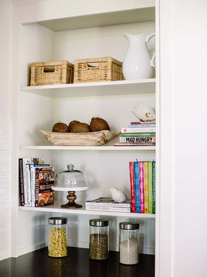 Utilizing some extra space for storage, this open shelving allows for showcasing items as well. / Photo by Robert Radifera